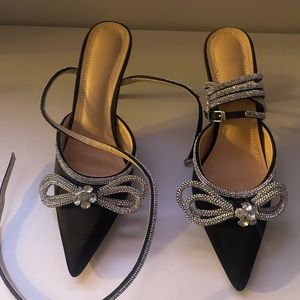 Strappy bow heels with rhinestone detail. Never worn.